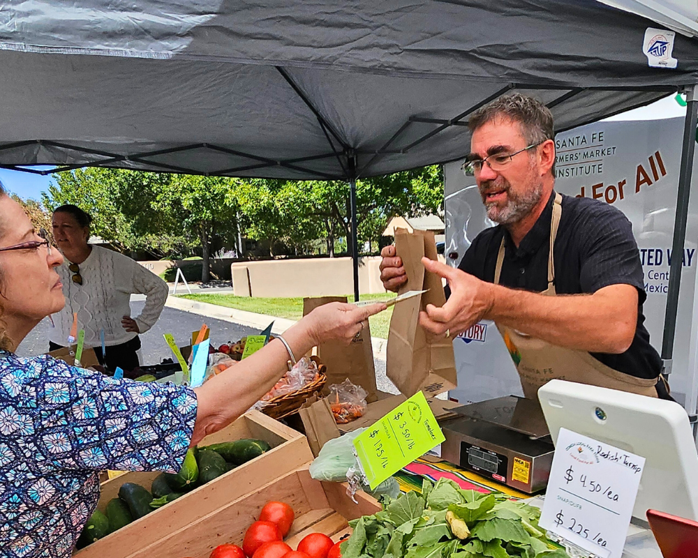 David Sundberg sells fresh local produce out of the Tianguis Movil on the South Side of Santa Fe, New Mexico.