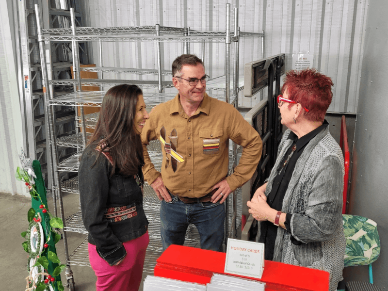 Representative Teresa Leger Fernández talking with Santa Fe Farmers' Market Institute staff. Representative Teresa Leger Fernández talking with Santa Fe Farmers' Market Institute staff.