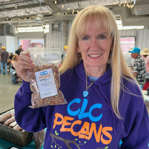 Representative Teresa Leger Fernández talking with Santa Fe Farmers' Market Institute staff.